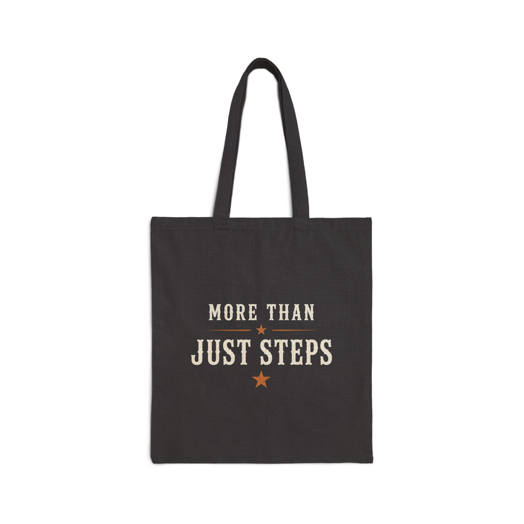 Close-up of the black cotton tote and printed Step Culture Collective logo.