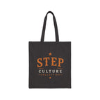 Black canvas tote bag with Step Culture Collective branding on a clean product background.