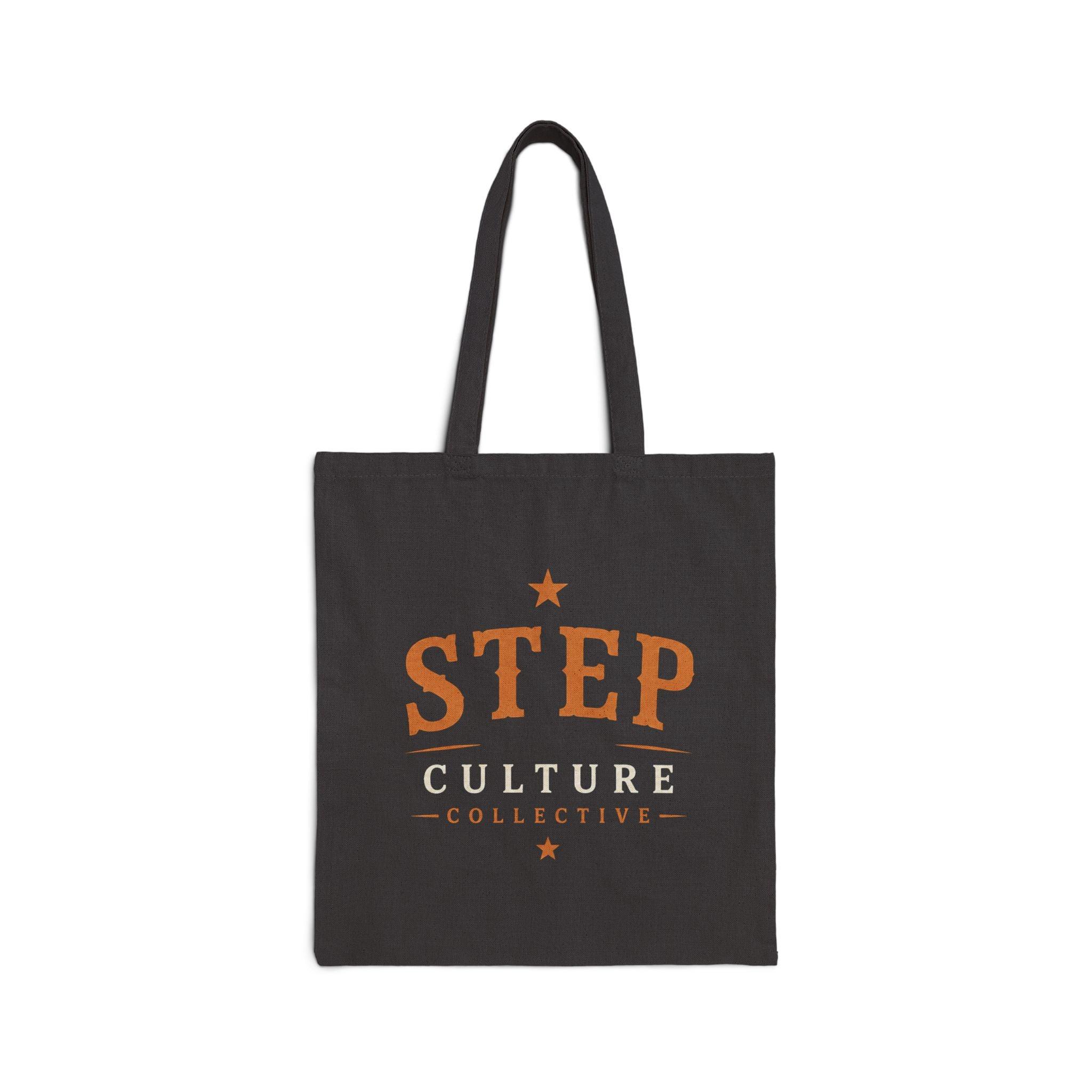Black canvas tote bag with Step Culture Collective branding on a clean product background.