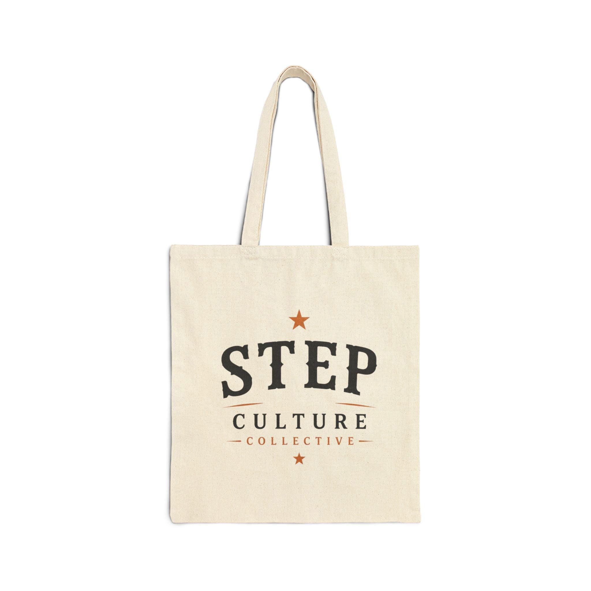 Natural canvas tote bag with Step Culture Collective branding on a clean product background.