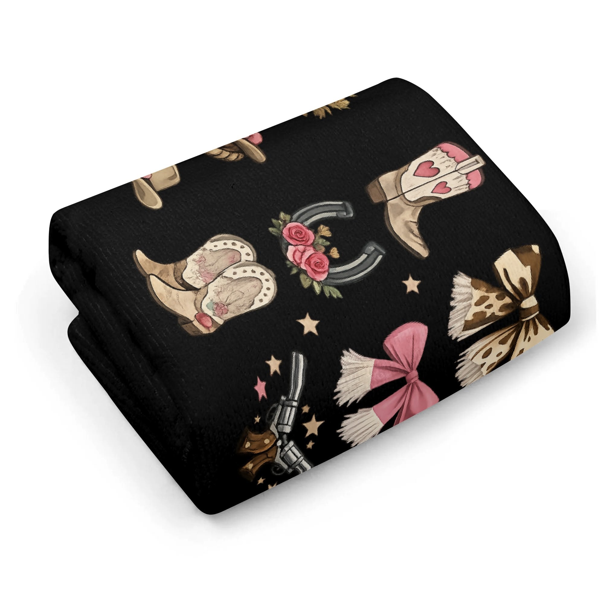 Folded black western cowgirl quick-dry towel showing pink boots, bows, horseshoes and hats