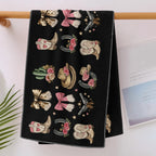 Black western cowgirl sports towel hanging over a wooden towel rail