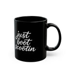 Just Boot Scootin black ceramic mug shown from the front