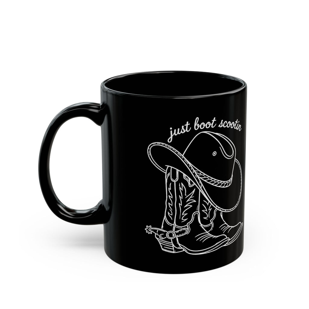 Just Boot Scootin black ceramic mug shown from the opposite side