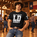 Man wearing the black LD Addict line dancing T-shirt with white front print and sleeve stars