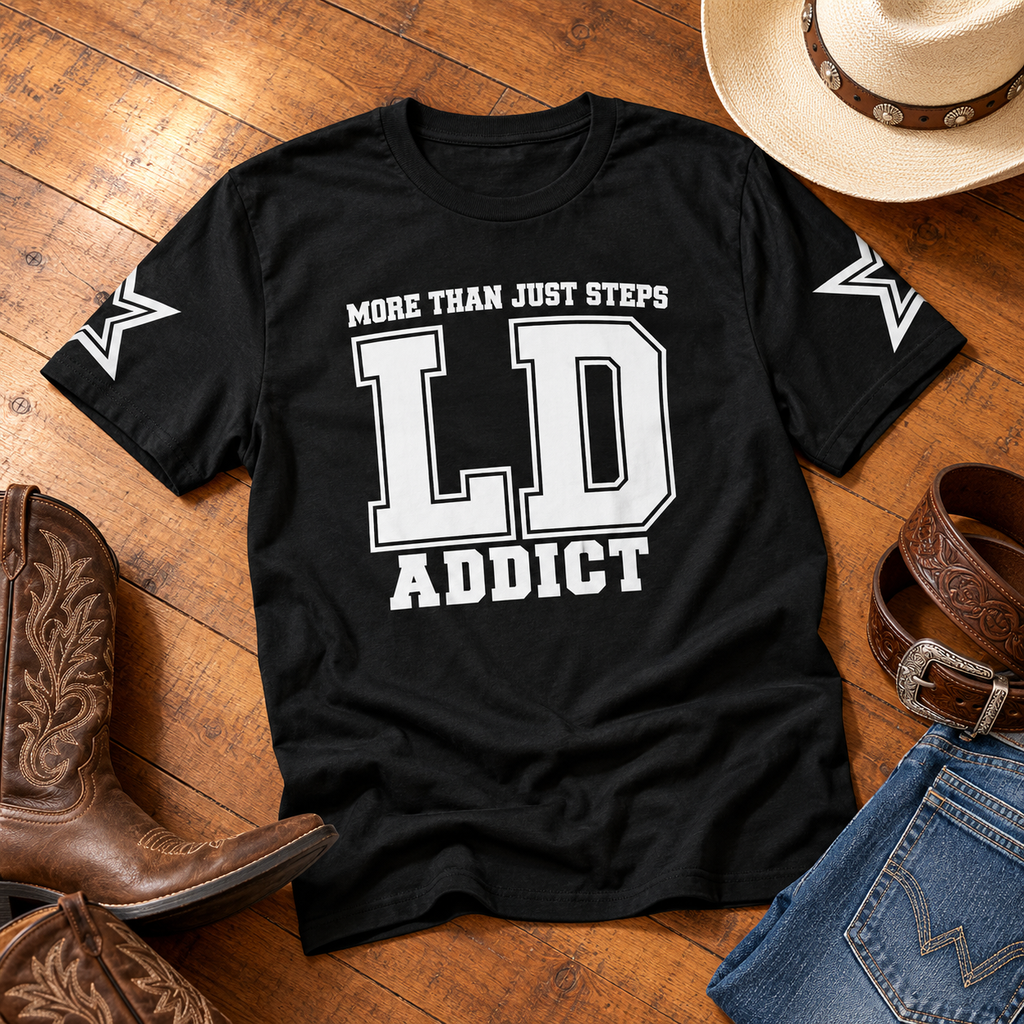 Black LD Addict line dancing T-shirt flat lay with cowboy boots, hat, belt and jeans