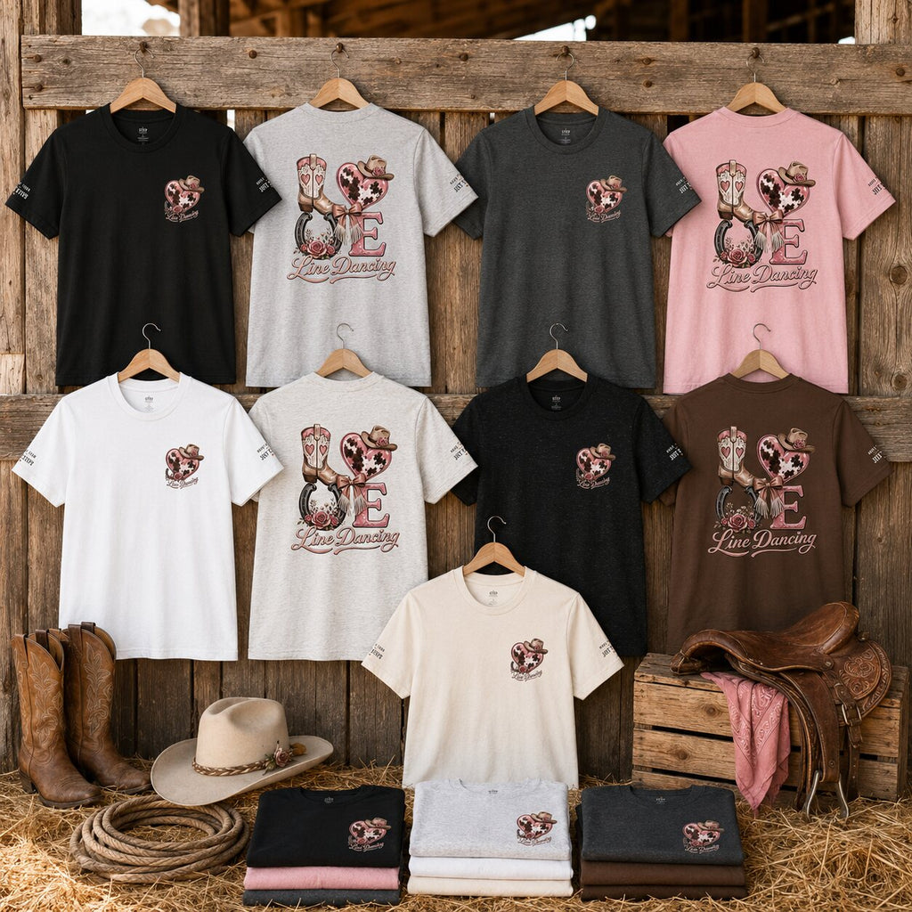 Line Dancing Love graphic tees in nine colours displayed on a timber fence with cowboy boots, hat and saddle