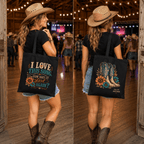 Black canvas tote bag with colourful cowboy boots and floral artwork reading ‘I Love This Song… How Does It Start Again?’