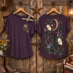 Purple Moonflower gold elastic shoulder top shown hanging front and back in a rustic barn setting