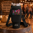 Peace Love Line Dance black bottle carrier with a 40 oz tumbler displayed on a wooden barrel
