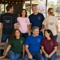 Mixed group wearing personalized custom T-shirts with pocket image, name and back design placeholders