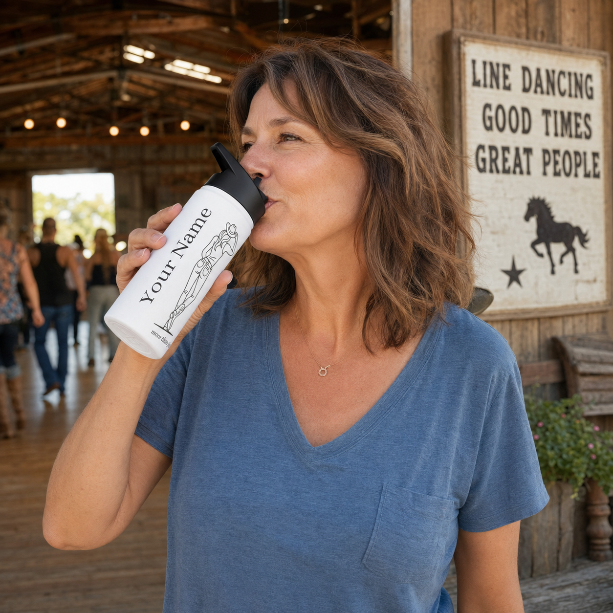Woman drinking from a personalized line dance stainless steel water bottle with cowgirl design and name placeholder