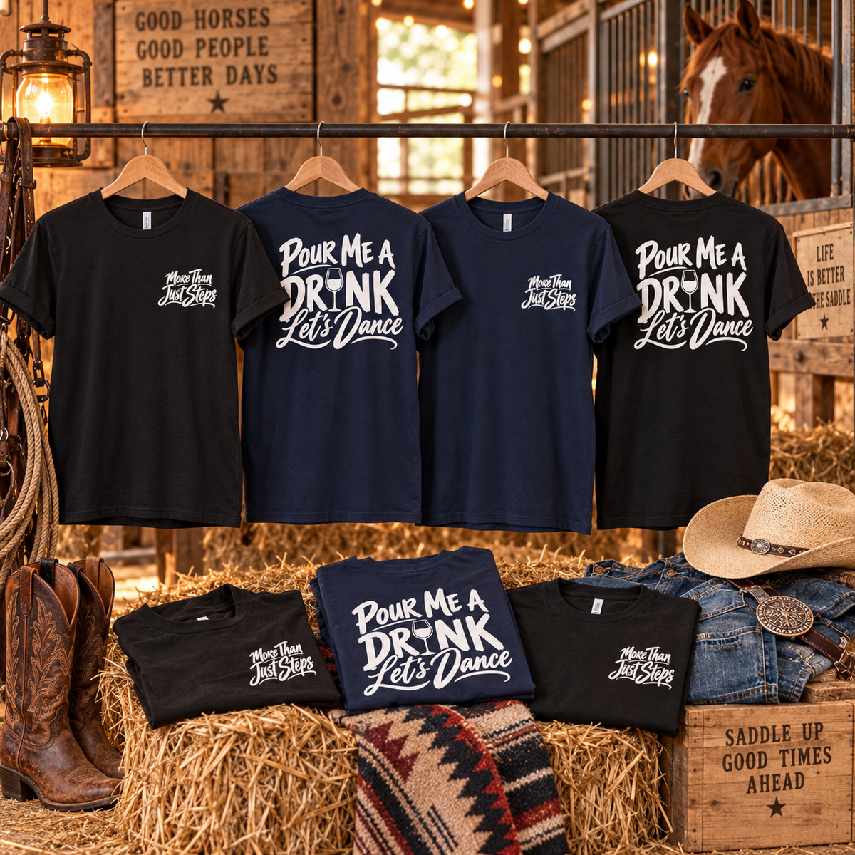 Black and navy Pour Me a Drink Let’s Dance cotton T-shirts hanging in a rustic stable with front and back designs, cowboy boots, hat and horse