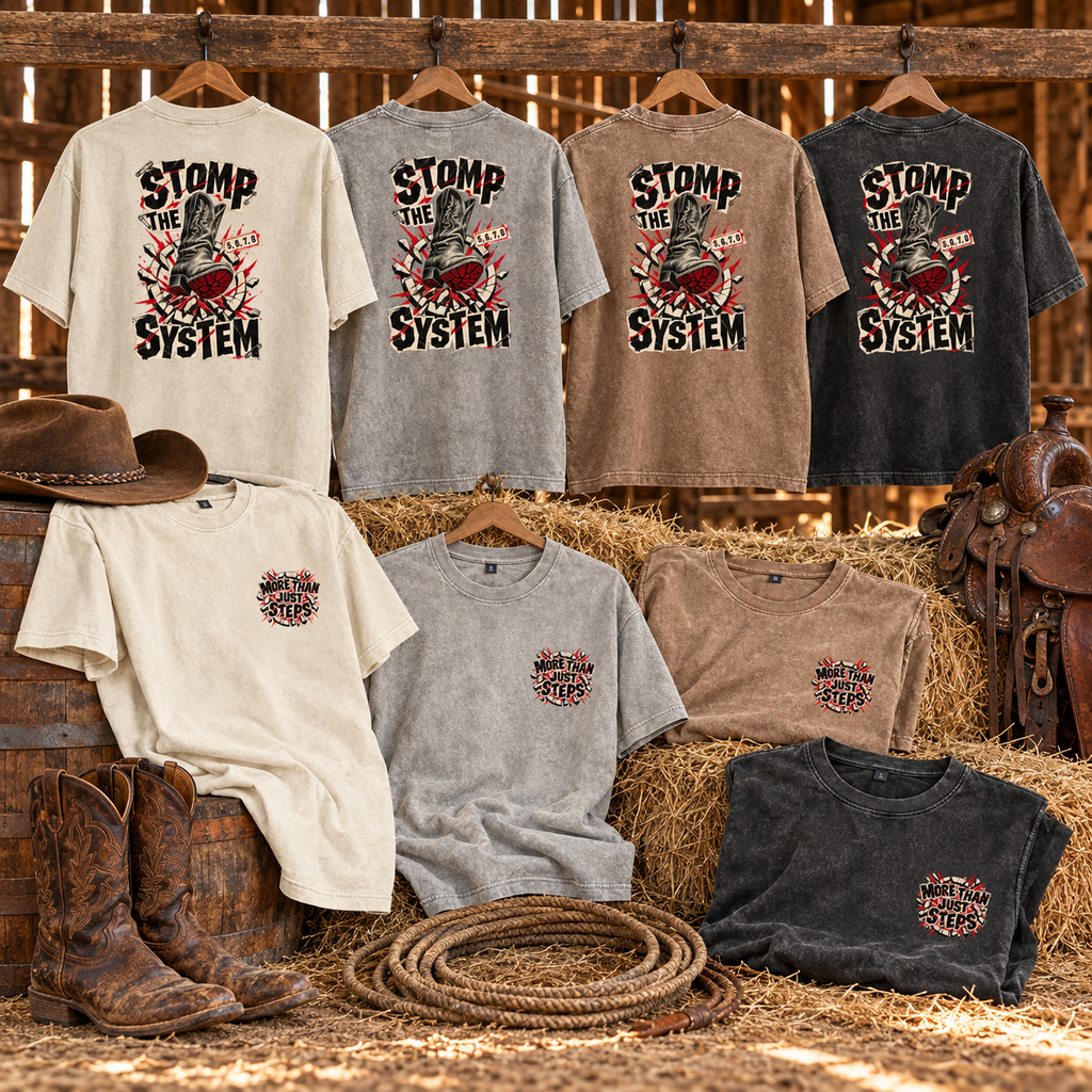 Stomp the System vintage washed T-shirts in four colours displayed in a rustic barn