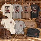 Stomp the System vintage washed T-shirts in four colours displayed in a rustic barn