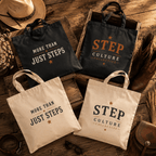 Natural and black cotton canvas tote bags featuring the Step Culture Collective signature logo.